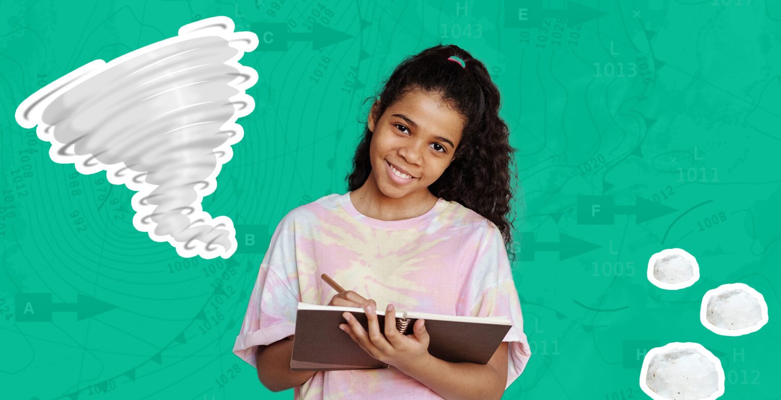 girl draws in a book and smiles. Grey hurricane to her left side