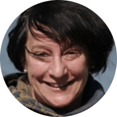 new Sheryl. Dark hair, smiling at camera